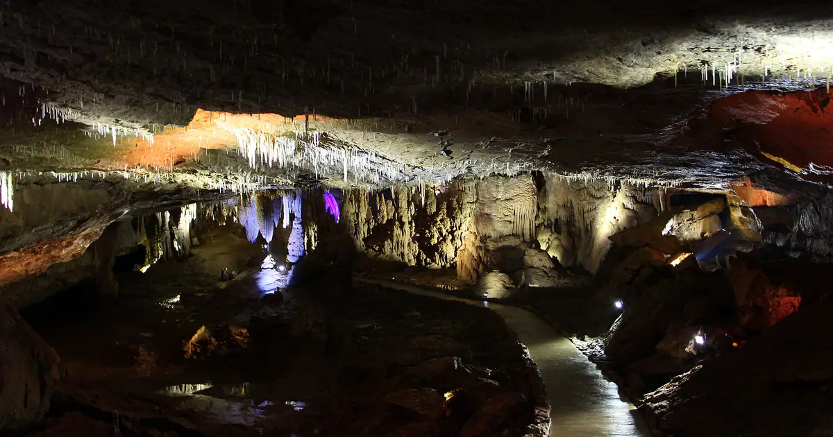 Lit walkway under the vaults of Kumistavi Cave