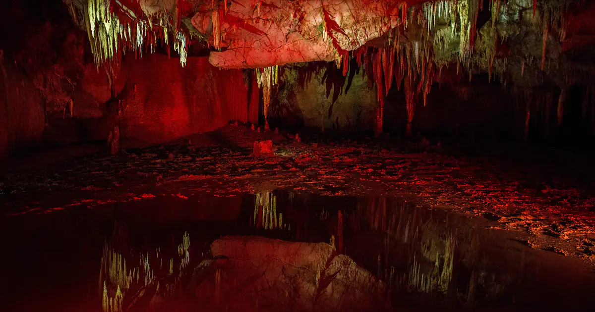 Underground lake reflecting stalactites