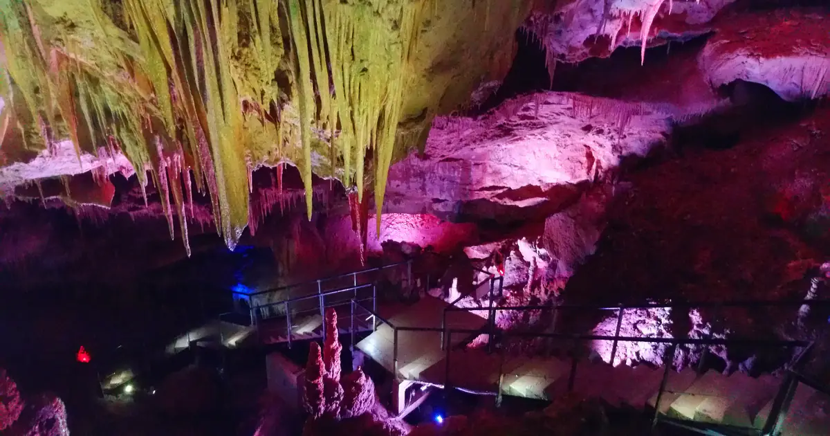 Lit hall with stalactites on the visitor trail